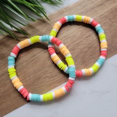 *This listing is for ONE bracelet.  The Summer Splash heishi bead bracelet is a fun mix of bright color heishi beads. Neon red, orange, green and blue are perfect for a day at the beach, a tropical destination, or just a random Tuesday! *For quantities over 10 sets, please send me a message prior to ordering, to ensure the turn-around time fits your timeframe. *Need a size not listed? Message me! I'd be happy to make it for you! BRACELET DETAILS -6mm clay heishi beads - Bracelets are made with h Colorful Beach Bracelets With Round Beads, Fun Colorful Beaded Friendship Bracelets For Vacation, Colorful Beaded Friendship Bracelets For Vacation, Colorful Round Beads Friendship Bracelets For Vacation, Colorful Fun Friendship Bracelets For Beach, Colorful Round Bead Friendship Bracelets For Vacation, Multicolor Heishi Beads Bracelets For Vacation, Fun Round Beads Stretch Bracelet For Beach, Rainbow Beaded Friendship Bracelets For Beach