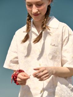 This product, the Sea Embroidery Shirt, captures a relaxed, beach-inspired aesthetic perfect for casual wear. The shirt features subtle embroidery that adds a touch of personality to the overall design. It is tailored for comfort with a loose fit, making it ideal for warm weather or a laid-back day by the sea. - This Sea Embroidery Shirt is adorned with delicate sea-themed embroidery on the front, adding a unique detail.- The short sleeves and lightweight fabric ensure comfort and breathability during hot weather.- Its loose, relaxed fit makes it perfect for casual outings and beach trips, offering both style and ease.- The shirt also features a classic button-up front and a soft collar, enhancing its versatile and timeless appeal. Relaxed Fit Floral Embroidery Shirt For Vacation, Floral Embroidered Collared Shirt For Vacation, Embroidered Summer Shirt For The Beach, Relaxed Fit Floral Embroidered Beach Shirt, Summer Embroidered Relaxed Fit Shirt, Summer Floral Embroidered Collared Shirt, Summer Floral Embroidery Relaxed Fit Shirt, Summer Floral Embroidered Relaxed Fit Shirt, Relaxed Fit Floral Embroidered Shirt For Beach