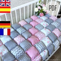 the baby crib bedding is made with pink, grey and white chevrons