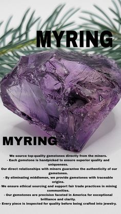 a purple rock sitting on top of a white table next to a pine branch with the words, myrring