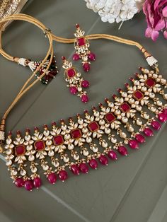 Discover the epitome of elegance with our premium necklace set. Crafted with precision and designed to turn heads, this set is a true masterpiece. Product Details: Material: Each piece is meticulously handcrafted from high-quality brass, copper, silver, Pachi Kundan, gold plated, ruby beads Choker Necklace Dimensions: Weight: 112 grams. Closure Type: Premium Dori Adjustable Size: Yes  Earring Dimensions (Per Pair): Weight: 20 grams Length: 6 cm Width: 2 cm Closure Type: Push Back Exquisite Desig Elegant Brass Kundan Chandbali Necklace, Elegant Kundan Chandbali Necklace In Brass, Elegant Chandbali Kundan Necklace In Brass, Elegant Brass Kundan Necklace For Celebration, Elegant Kundan Necklace For Celebration, Elegant Chandbali Bridal Necklace In Brass, Ceremonial Brass Matching Earrings, Elegant Ceremonial Jewelry Sets With Matching Earrings, Traditional Brass Jewelry With Elegant Design