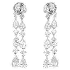 Indulge in the brilliance of these 4.78 Carat Natural Diamond Earrings, set in exquisite 18 Karat White Gold. The earrings showcase exceptional diamonds with an average clarity of SI1-SI2 and a color grade of H-I, ensuring a stunning sparkle from every angle. With a larger size of approximately 35 mm, these earrings are designed to impress and make a bold statement, whether for a formal event or an elegant evening out. FOLLOW SPECTRUM JEWELS storefront to view the latest collection & exclusive p Earring Video, Evening Earrings, Round Diamond Earrings, Diamond Dangle Earrings, White Gold Jewelry, Yellow Gold Earring, Top Seller, Round Brilliant Cut Diamond, Diamond Clarity