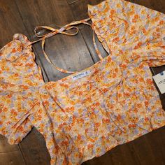 Nwt Arizona Jeans Co. Floral Sunched Ruffley Top With Puffy Like Sleeve. Has Front Tie Detail And One On The Back To Keep The Sleeves Higher If You Want. Reg $36. Measures 7 3/4" Back Middle Top To Bottom, 10" At The Highest Part On The Front To The Bottom, 15 1/2" Pit To Pit. Fitted Ruffle Hem Crop Top For Summer, Spring Day Out Crop Top With Ruffles, Casual Spring Crop Top With Ruffle Hem, Casual Ruffle Hem Crop Top For Spring, Spring Ruffled Crop Top For Day Out, Spring Crop Top With Ruffles, Yellow Puff Sleeve Top With Ruffles, Spring Ruffle Crop Top For Brunch, Spring Ruffled Crop Top For Brunch