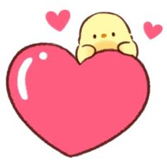 a small bird sitting on top of a big heart