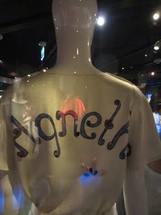 a mannequin's torso with the word spring written on it in black ink