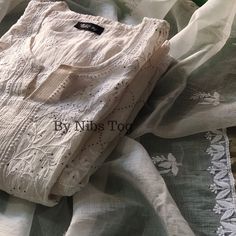 Nibs Tog Roohani Ivory Chikankari Kuta with Dupatta Set Pure Mulmul Chanderi (Semi Stitched), Indian Ethnic Party Wear Chikankari Suit Dyeble Shop More Chikankari outfits by Nibs Tog on our Shop : https://www.etsy.com/in-en/shop/NibsTog PLEASE NOTE: Since its hand embroidery, every design has single piece only, therefore, you may get a different design motif Suit. This also ensures the uniqueness of the outfit you will receive. Please connect us to check the designs available. Package Includes: Kurta+Dupatta Features: Fabric: The Ivory Chikankari Suit is made of Pure mulmul Chanderi Cotton fabric. Super soft & versatile. Style: The Chikankari Suit is made in Slight A Line pattern. The Suit is Semi Stitched and has Chikankari hand embroidery, embellished with mukaish. Colour: The Chikankari Off-white Churidar With Straight Kurta, White Chanderi Sharara With Straight Kurta, Designer Wear Cream Kurta For Navratri, Designer Cream Kurta For Navratri, Eid Off White Salwar Kameez With Cutdana, Eid Salwar Kameez In Off-white With Cutdana, Off White Salwar Kameez With Cutdana For Eid, Straight Kurta In Off White With Cutdana Details, Cream Straight Kurta With Cutdana Details