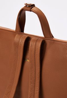 Sometimes all we need is a minimalist style, that's where this two-in-one piece comes in. Our Rovigo Tote offers the perfect blend of simplicity with a practical design. Expertly handcrafted in Full-Grain leather, it has a soft structure that makes it lightweight and an ample main compartment to carry all essentials, including a 15” laptop. This bag is about to make you the best-accessorized person in the block. Dimensions- Height 14,3" - Length 15,7" - Width 4,7" Tote Bag Making, Family Room Accent Chair, Minimalist Tote, Shoe Storage Shelf, Daybed Covers, Bedding Basics, Practical Design, Tote Backpack, Minimalist Style