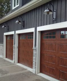 two brown garage doors in front of a gray building