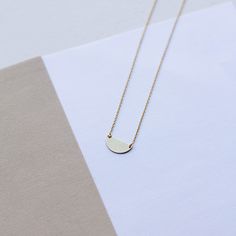 "HALF MOON NECKLACE A dainty gold chain necklace with a small half circle pendant in 9K or 14K solid gold. Minimalist design, delicate necklace ideal for everyday wearing, layered with other necklaces. This semicircle necklace is a great choice for a Mothers Day gift for mom. F E A T U R E S * Metal: High-quality Solid Gold 9K or 14K * Color: Yellow Gold, White Gold, Rose Gold * Dimensions: 15 x 7mm * Length: 16\" to 19.5\" (40cm to 50) Solid Gold jewelry is the best choice if you want your jewe Minimalist Moon Shaped Jewelry In 14k Gold, Minimalist Moon Shaped 14k Gold Jewelry, Minimalist 14k Gold Moon Jewelry, Minimalist 14k Gold Filled Round Necklace, Minimalist Yellow Gold Circle Necklace, Minimalist Yellow Gold Necklace With Moon Charm, Dainty Half Moon Necklace In 14k Gold, Minimalist Jewelry With Adjustable Half Moon Chain, Minimalist 14k Gold Moon Charm Jewelry