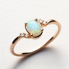 Opal ring for women gold, sterling silver opal ring vintage opal ring white gold, opal jewelry Opal Ring for Women - Vintage Gold and Sterling Silver Opal Jewelry Description: Elevate your style with our exquisite Handmade Opal Ring for Women, meticulously crafted to capture the timeless allure of opals. Available in both classic sterling silver and elegant gold, this vintage-inspired piece is a true testament to opal's natural beauty. Specifications: Material: Solid 925 sterling silver / Gold Plated and also available in solid gold  Stone: High-Quality Natural Ethiopian Opal Metal Options: Sterling Silver, White Gold Sizes Available: All sizes available  Key Features: High-Quality Opal: Our opals are handpicked for their mesmerizing play of colors, ensuring each ring is a unique masterpie Elegant Opal Jewelry With Cabochon, Elegant Opal Cabochon Jewelry, Dainty Opal Cabochon Jewelry, Oval Opal Gemstone Rings, Classic Opal Gemstone Ring, Classic Opal Cabochon Jewelry, Classic Oval Opal Jewelry, Classic Opal Birthstone Jewelry, Elegant Gold Opal Ring