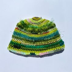 1 of 1 crocheted bucket hat using a mix of acrylic, cotton, and vintage yarns Handmade Green Crochet Hat, Casual Style, Green Knitted Hat For Spring, One Size Yarn Mini Hats For Spring, Whimsical Yarn Crochet Cap, Multicolor Crochet Yarn Cap, Whimsical Crochet Yarn Cap, Multicolor Crochet Cotton Yarn Hat, Hand Knitted Multicolor Crochet Hat In Yarn, Hand Knitted Multicolor Crochet Hat