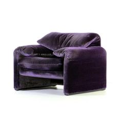 a purple chair sitting on top of a white floor