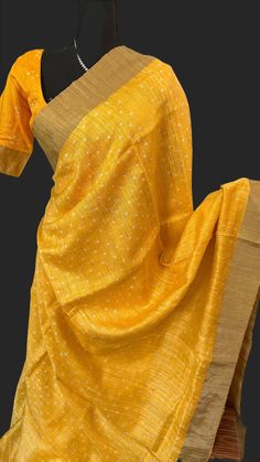 Pure Raw silk saree woven borders with zari border. Material ; Pure silk saree bandhani pallu and blouse. Blouse : prestitched blouse size 36 - goes upto 42   DETAILS AND CARE Color :yellow     Weight : 600 - 800 grams Length : 5.5 m saree + 0.7 m blouse  Width : 48 Inches Fabric : pure  silk   Craft Description : bandhini Wash Care : Dry Wash Only Shipping Time : 5 - 7 Working days We Ship Worldwide SHIPPING AND RETURNS Shipping Policy : Shipping days as mentioned above, subject to changes based on the government regulations around the prevailing pandemic situation. Return Policy : No returns on the orders that have personalization such as Blouse Stitching , Fall / Pico work.We have a comprehensive returns policy , kindly refer to our policy section to know more . DISCLAIMER Color: There Black And Red Saree, Red Velvet Blouse, Readymade Blouses Online, Raw Silk Saree, Silk Saree Blouse, Red Saree, Velvet Blouses, Readymade Blouse, Soft Silk Sarees