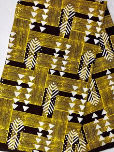 "Material: 100% cotton TOP QUALITY FABRIC Print: DOUBLE-sided  Width: 45\" This timeless appeal & adorable African print is perfect for making African Clothing, African Quilts, Upholstery, Home Décor, and unique accessories. FABRIC CUT:        Purchase of 1+ yards per customer will be cut as 1 continuous  piece of fabric up to a maximum length of 6 yard. LABELS: All African fabric is sold with an adhesive Manufacturer label attached. Create your unique one of a kind piece. Get it today.  Each pi Cotton Fabric With Graphic Print, Patterned Cotton Fabric With Graphic Print, Yellow Cotton Fabric With Geometric Pattern, Black Printed Cotton Patterns, Summer Cotton Fabric With Pattern Prints, White Cotton Fabric For Summer, Yellow Geometric Pattern Cotton Fabric, White Cotton Summer Fabric, Printed Yellow Ankara Fabric