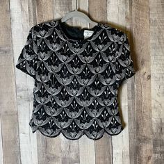 "90s Vintage Papell Boutique Silk Beaded Black Scallop Top Excellent condition! Size Large Petite Pit-to-Pit: 18\" Length: 20\" Formal evening blouse Short sleeve top 100% silk Back hidden zipper closure Scoop neckline Cap sleeves Shoulder Pads Tapered at waist Scalloped hem Lined Tags Party, cocktail, gorgeous, luxury, designer, formalwear, dinner, special occasion, special event, wedding, beautiful, pretty, sparkle, shimmer, boho, indie, Christmas, new years eve" Spring Evening Crew Neck Blouse, Crew Neck Evening Blouse For Spring, Evening Crew Neck Blouse For Spring, Vintage Short Sleeve Tops For Party, Summer Formal Sequin Blouse, Spring Evening Embellished Top, Embellished Evening Top For Spring, Formal Summer Sequin Blouse, Embellished Tops For Evening In Spring