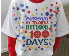 a young boy wearing a tshirt that says pushing my teacher's buttons for 100 days