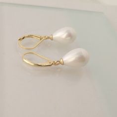 Teardrop Pearl Earrings Ivory White Pearl Earring for Women | Etsy Mexico Elegant Pear-shaped Pearl Earrings For Anniversary, Elegant Teardrop Earrings For Formal Occasions, Elegant Pear-shaped Bridal Earrings, Elegant Pear-shaped Earrings For Party, Elegant Pear-shaped Bridal Earrings For Pierced Ears, Elegant White Pear-shaped Teardrop Earrings, Elegant Teardrop Drop Earrings, Elegant Teardrop Jewelry With Matching Earrings, Elegant Teardrop Jewelry For Anniversary