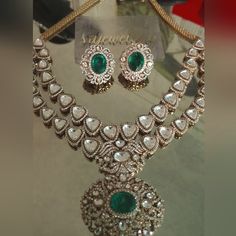 Very Lavish Beautifully Crafted Green Large Moissanite With Cz Stones On Gold Plated Necklace Set With Matching Earrings. Green And Gold Jewelry Set, Dazzling Diamond Necklace For Festive Occasion, Formal Jeweled Cubic Zirconia Jewelry Sets, Formal Cubic Zirconia Jeweled Jewelry Sets, Elegant Diamond Kundan Necklace For Reception, Luxury Hand Set Diamond Emerald Necklace, Luxury Hand Set Emerald Diamond Necklace, Exquisite Emerald Diamond Necklace, Festive Diamond Necklace With Jewels