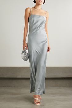 ST. AGNI's slip dress is an investment that you'll wear season after season. It's cut on the bias from soft stretch silk-blend satin and twirls to reveal a low back. It showcases exactly what this label does best: simple elegance with quality woven in every thread. Grey Satin Dress Outfit, Long Silver Dress, Silver Silk Dress, Silver Satin Dress, Grey Satin Dress, Satin Dress Outfit, Grey Silk Dress, Minimalist Glam, Satin Outfits