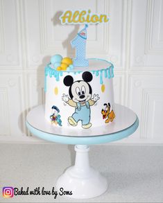 a mickey mouse birthday cake with the number one on it