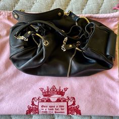 Beautiful Juicy Couture Handbag In Excellent Condition. Black Leather With Gold Accessories And A Large Juicy Bag. Designer Pouch Hobo Bag, Leather Shoulder Bag With Branded Hardware For Party, Party Leather Shoulder Bag With Branded Hardware, Designer Leather Hobo Bag With Branded Hardware, Chic Shoulder Bag With Palladium Hardware, Luxury Pouch Shoulder Bag With Palladium Hardware, Luxury Shoulder Bag With Palladium Hardware, Luxury Leather Shoulder Bag For Party, Luxury Hobo Satchel Bag With Silver-tone Hardware