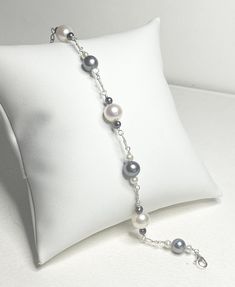 This pearl bracelet was created using professionally cleaned vintage genuine cultured pearls of Akoya, apparent Tahitian, and freshwater types. Some of the small black pearls are dyed but most not; well matched though. The smaller beads are all freshwater pearl and about 3mm. The largest pearls are 8mm and Akoya. The 7mm black pearls are natural in color and may be all freshwater or 1-2 small Tahitian. I'm pricing them as freshwater.  The bracelet is 7.5" long and weighs 6.4g. Solid sterling silver was used for all metal components of this piece. Black And White Beaded Bracelet, White Beaded Bracelet, South Sea Pearl Necklace, Black Pearl Earrings, Rose Gold Pendant Necklace, Golden South Sea Pearls, Saltwater Pearls, Black Pearls, Rose Gold Pendant