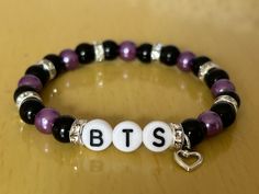 ⚠️Warning ⚠️ WE DO NOT SHIP TO GERMANY! Hi welcome to our new mini business!! What we are selling here is a classy BTS/ARMY bracelet.  These are some of the best features about our product: Bead Type: Glass Pearl (size- 6mm) 9 Crystal Spacers  1 Open Heart Charm Alphabet beads  Strong Elastic Has Bead Glue for extra safety Packaging: Free NON official photocard with pouch  Free mini disk with group name on organza bags  The inspiration behind this product came from having a lot of kpop friends a Kpop Personalized Beaded Bracelets As Gift, Kpop Style Personalized Beaded Bracelets As Gift, Customizable Kpop Style Beaded Bracelets As Gift, Silver Beaded Bracelets Kpop Style For Gift, Silver Beaded Kpop Bracelets As Gift, Silver Beaded Kpop Style Bracelets, Kpop Style Silver Beaded Bracelets, Alphabet Beads, Friend Bracelets