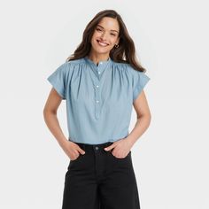 This Popover Short-Sleeve Blouse from Universal Thread™ makes a perfect pick for warm summer days. Fashioned in a casual fit, it features a front button placket and a curved hemline with side slits for relaxed style. The lightweight cotton fabric offers cool and comfortable all-day wear, and you can pair this blouse with your choice of pants or skirts to create a range of stylish outfits. Universal Thread™: Found exclusively at Target. Mom Capsule Wardrobe, Casual Mom Style, 60 Outfits, Kick Flare Jeans, Slip Skirts, Spring Capsule Wardrobe, Brand Shoot, Fall Capsule Wardrobe, Chambray Shirt