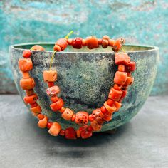 A stunning strand of antique coral beads at a very good prize! These lmatching mediterranean coral beads are a must have for your tribal and ethnic jewelry projects! Last picture gives some inspiration! For more sets and strand, click here: https://creatoriq.cc/3DZZXNZ ✔️ Shape: corn and small tube beads ✔️ Weight: 45 grams ✔️ Size bead: 4-10 mm, diameter 5-12 mm ✔️ Total length: ca 42 cm ✔️ Temporarily strung ✔️ Origin: Mediterranean Sea ✔️ Condition: very good, consistent with age and use ✔️ T Traditional Coral Gemstone Beads, Orange Bohemian Red Coral Beads, Bohemian Orange Red Coral Beads, Coral Bohemian Polished Beads, Bohemian Coral Gemstone Beads, Bon Prix, Unique Bracelets, Coral Beads, Mediterranean Sea