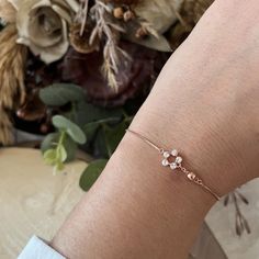 This Crystal Flower Silver Bracelet is the perfect addition to your jewelry collection. Made from high-quality sterling silver, this dainty piece features a delicate floral design accented with sparkling crystals, adding a touch of elegance to any outfit. Its minimalist style makes it versatile for both everyday wear and special occasions. Looking for the perfect gift for her? Whether it's for a birthday, anniversary, bridesmaid gift, or just a thoughtful surprise, this bracelet is sure to delight. Its lightweight and adjustable design ensures a comfortable fit, while its timeless beauty complements any personal style. Handcrafted with care, this Dainty Silver Jewelry piece comes in a beautiful gift box, ready to impress your loved ones. Elevate your gift-giving or treat yourself to this e Dainty Silver Jewelry, Bracelet Dainty, Wedding Jewelry Bracelets, Crystal Flower, Sparkling Crystal, Wedding Bracelet, Perfect Gift For Her, Beautiful Gift Boxes, Bridesmaid Gift