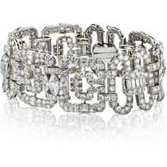 Indulge in the captivating allure of our Art Deco Platinum Diamond Link 1930's Bracelet. This exquisite piece is more than just jewelry; it is a wearable heirloom that tells a story of timeless elegance and impeccable craftsmanship.Every detail has been meticulously crafted to perfection, making this bracelet truly exceptional. With a staggering 28.00 carats of multi-shaped diamonds, each carefully selected for their brilliance and radiance, this bracelet is a testament to the artistry of the er Vintage White Gold Hand-set Bracelets, Vintage Platinum Tennis Bracelet For Anniversary, Vintage Brilliant Cut Tennis Bracelet For Wedding, Vintage White Gold Diamond Jubilee Bracelet, Vintage Diamond Bracelet With Brilliant Cut For Formal Occasions, Vintage Brilliant Cut Diamond Bracelet For Wedding, Vintage Platinum Diamond Bracelet For Formal Occasions, Classic Evening Platinum Bracelets, Timeless Platinum Bracelets For Evening