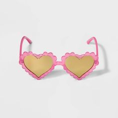 a pair of heart shaped sunglasses on a white background