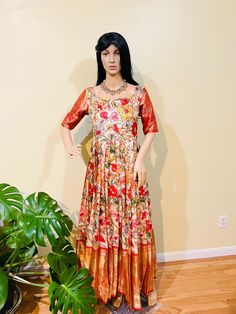 "Step into the world of elegance with this stunning kalamkari long gown, featuring a flowing 55-inch length and a flattering 38 Ready Size design with room for adjustment up to 42 inches. Handcrafted with love, this gown showcases intricate, centuries-old kalamkari artistry in every delicate stroke and swirl. Perfect for special occasions or everyday glamour, this gown's fluid lines and natural dyes create a mesmerizing visual effect. Pair with statement jewelry for a red-carpet look or keep it Festive Floor-length Dress With Kalamkari Print, Multicolor Floor-length Lehenga With Kalamkari Print, Kalamkari Print Maxi Length Dupatta, Luxury Floor-length Kalamkari Print Dresses, Luxury Floor-length Kalamkari Print Dupatta, Red Carpet Look, West Chester, Long Gown, Chester