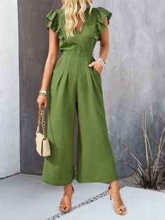 Unleash your inner fashion icon with the All Time Classic Wide Pants Jumpsuit. This classic and timeless piece features wide leg pants that provide comfort and effortless style. Perfect for any occasion, this jumpsuit is a staple in any wardrobe. Upgrade your fashion game today! Size Guide: Model is 5’85” tall, and has a 34.1” bust, 24.2” waist, & 35.7” hips. She is wearing a S / US 4 / AU 8. This jumpsuit is true to size. Material: 95% Polyester, 5% Elastane Feature: V-Neckline. Ruffle shoulder. Wide leg. Not lined. Back button closure. Relaxed fit. Care Instructions: Machine wash / Cold hand wash Trendy Wide Leg Cotton Jumpsuits And Rompers, Trendy Wide-leg Cotton Jumpsuits And Rompers, Trendy Wide-leg Cotton Jumpsuit, Trendy Cotton Wide Leg Jumpsuits And Rompers, Trendy Wide Leg Jumpsuits And Rompers For Spring, Trendy Wide-leg Jumpsuits And Rompers For Spring, Non-stretch Wide Leg Jumpsuits And Rompers, Chic Solid Overalls With Pockets, Wide Leg Solid Color Jumpsuit For Work