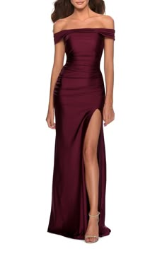 A stunning neckline frames your shoulders and ruching defines your waist in this satin trumpet gown with modern-day fairy-tale allure. Style Name:La Femme Off The Shoulder Satin Trumpet Gown. Style Number: 6010069. Formal Full-length Ruched Evening Dress, Formal Full Length Ruched Evening Dress, Formal Ruched Full-length Evening Dress, Full Length Ruched Evening Dress, Fitted Satin Finish Bridesmaid Gown, Full-length Gown With Ruched Bodice, Fitted Floor-length Evening Dress With Satin Finish, Formal Fitted Gown With Satin Finish, Fitted Satin Gown For Prom