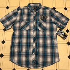 Nss Plaid Shirt Size Large New With Tags! Very Cool Skull And Wings Design On Chest Two Front Pockets Ships From A Smoke And Pet Free Home Reasonable Offers Welcome Blue Fitted Cotton Short Sleeve Shirt, Fitted Blue Cotton Short Sleeve Shirt, Casual Plaid Short Sleeve T-shirt, Blue Streetwear Shirt With Button Closure, Blue Button Closure Streetwear Shirt, Blue Button Closure Shirt For Streetwear, Casual Blue Cotton Short Sleeve Shirt, Casual Blue Short Sleeve Cotton Shirt, Casual Fitted Plaid Shirt