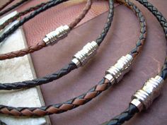 A simple, tasteful and masculine leather necklace is an essential Men's fashion accessory. This necklace style features Fine Imported Quality - 4mm leather cord and a secure -strong stainless steel magnetic closure clasp (19mm or in length) for easy on and off. All dyes used in our leather are certified 100% Lead-Free and meet all requirements of the German Goods Ordinance, REACH (European Union), ROoSH (U.K.), and CPSIA (U.S.) which require consumer goods to be free of Lead, AZO‰۪s and carcinog Mens Leather Necklace, Braided Leather Necklace, Necklace Mens, Jewelry Mens, Mens Necklace, Jewelry Men, Mens Braids, Unique Jewelry Designs, Leather Gifts