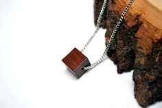 "Minimalist Cube Wood Pendant- Unique Wood bead Necklace - Choose your chain style and length  Cube Pendant measures 10mmX10mmX10mm LENGTH - You can select your desired length from the options drop-down choices or message me for a custom length. (If you do not leave me a note, I will send you a 28\" chain ) :) - Lengths 26\" and shorter will close with a clasp. Above 26\" have no clasp CHAIN STYLE -Select your desired style of chain from the option drop-down choices Or Convo me. QUALITY Affordable Jewelry doesnt need to look cheap! I take care in choosing my materials and only craft things I would want to wear myself. I carefully selected the chains. They are very study and durable. D E L I V E R Y / G I F T All items are made to order. I usually make the item the same day you order and ge Minimalist Brown Necklace For Gift, Minimalist Brown Necklace For Gifts, Minimalist Brown Necklaces For Gifts, Minimalist Brown Necklace For Everyday, Minimalist Brown Jewelry As A Gift, Minimalist Brown Jewelry As Gift, Minimalist Brown Jewelry For Gift, Minimalist Brown Sterling Silver Jewelry, Minimalist Brown Rectangular Jewelry