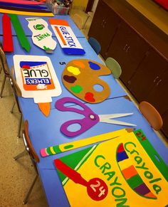 the table is covered with various crafts for children to make and use on their own