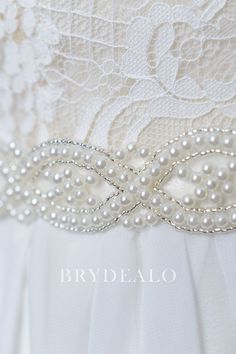 This charming and elegant bridal self-tie bridal sash belt features statement pearls embellished on the ivory satin in chic wave pattern. A nice accessory for your wedding gown. content satin, beading, pearls embellished portion length 45cm, width 3cm ribbon length 275cm, width 2cm Elegant Bridal Accessories With Pearl Embroidery, Elegant Pearl Embroidered Bridal Accessories, Elegant White Sashes For Ceremony, Elegant White Ceremony Sashes, White Beaded Sashes For Party, Elegant Pearl Embellished Sashes For Party, White Bridal Accessories With Sashes, White Satin Bridal Belt For Party, Elegant White Bridal Belt