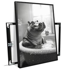 a black and white photo of a hippopotamus in a bathtub