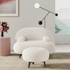 a white chair and ottoman in a living room with pink vases on the floor