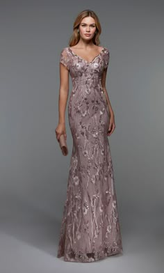 This form-fitted trumpet silhouette dress from Alyce Paris 27533 showcases delicate lace with shimmering sequins throughout, a v-neckline and back. Its exquisite design and flattering silhouette make it the perfect choice for any formal occasion, allowing you to make a bold and sophisticated statement. Formal Prom Dresses Short, Mother Bride Dress, Brides Mom Dress, Mother Of The Groom Gowns, Mothers Gowns, Mother Of Groom Dress, Slim Bodycon Dress, Mom Dresses, Mog Dresses