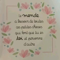 the words are written in spanish and english on a white plate with pink flowers around it