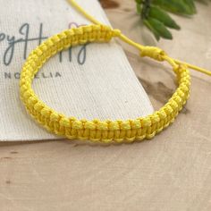 "Happy color macrame bracelet made of waxed cord. This waterproof adjustable bracelet has the perfect color to transmit energy, vibrant yellow! The color of the sun. This happy bracelet was designed for everyday wear. This minimalist boho yellow cord bracelet enhances your casual outfit.  ♥ ITEM DETAILS: Total length: The size of the bracelet is adjustable.  💕The bracelet has an adjustable closure that will work on a wrist of about 6 - 7\"💕 Materials: Waxed cord Waxed Cord Available: Yellow Waxed Cord Size: 1mm waxed cord ♥ GIFT IT Jewelry comes in a cute canvas bag ready to gift! If you wish your item to be a gift, please let me know and I will include a cute little card with a personal message. ♥ CURRENT PROCESSING TIMES: normally we ship orders out within 1-3 days  (the time I need to Yellow Bohemian Friendship Bracelets For Everyday, Trendy Yellow Adjustable Friendship Bracelets, Trendy Adjustable Yellow Friendship Bracelets, Yellow Summer Friendship Bracelets For Everyday, Handmade Trendy Yellow Friendship Bracelets, Yellow Friendship Bracelets As Summer Gifts, Casual Yellow Friendship Bracelets For Summer, Summer Yellow Friendship Bracelets, Summer Everyday Yellow Friendship Bracelets