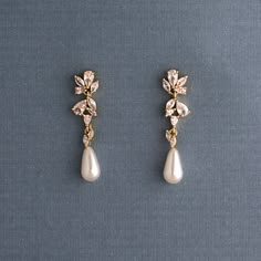 A single ivory teardrop pearl hangs from a delicate cluster of CZ jewels. These wedding day earrings are delightfully elegant. They are about 1.25 inches long and .25 inches wide, lead and nickel free, grade AAA CZ stones. Nose Piercing Gold, Jewelry Aesthetic Silver, Aesthetic Silver Jewelry, Wedding Day Earrings, Gold Jewelry Aesthetic, Engagement Earrings, Necklace Beads, Aesthetic Jewelry, Jewelry Aesthetic