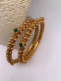 Green Stone Golden Bangles Bengali Bangles Gold, Golden Bangles Indian Design, Green Stone Necklace Indian, Bangles Gold Design, Bangle Designs Gold, Antique Gold Bangles Design, Green Stone Bangles, Bangles Jewelry Designs Gold, Gold Bangles Set