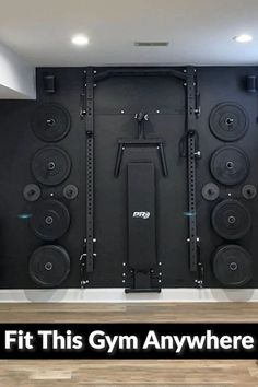 a gym room with speakers and equipment on the wall, in front of a black background