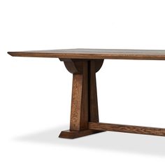 a wooden table with two legs and a long slab on one end that has been turned upside down