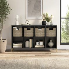 a living room scene with focus on the bookshelf and storage baskets in the foreground